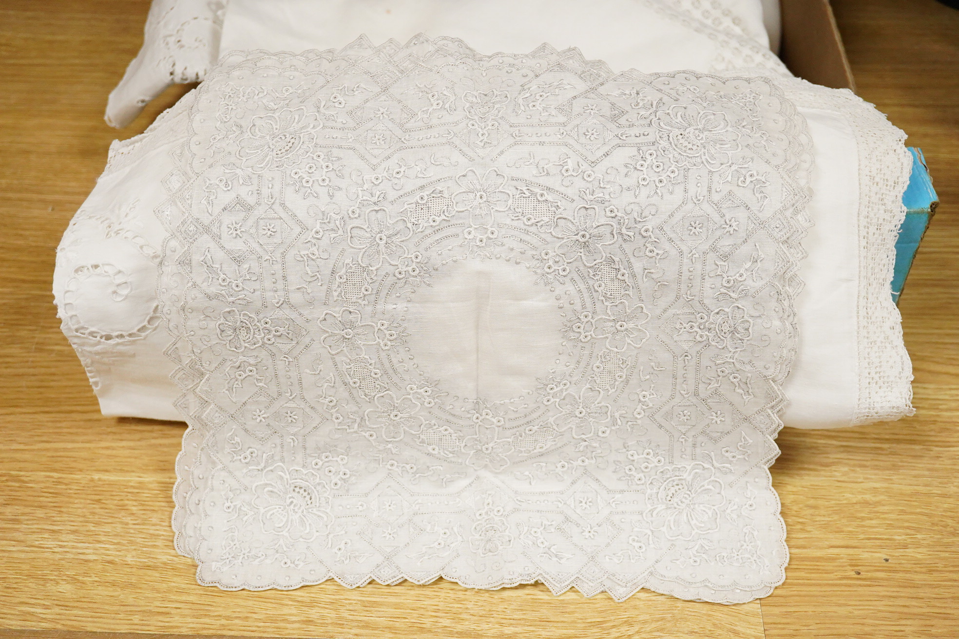 A collection of cutwork, needlework, filet, crochet and drawn thread worked table cloths etc